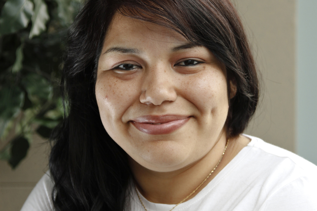 A young woman smiling for the camera.