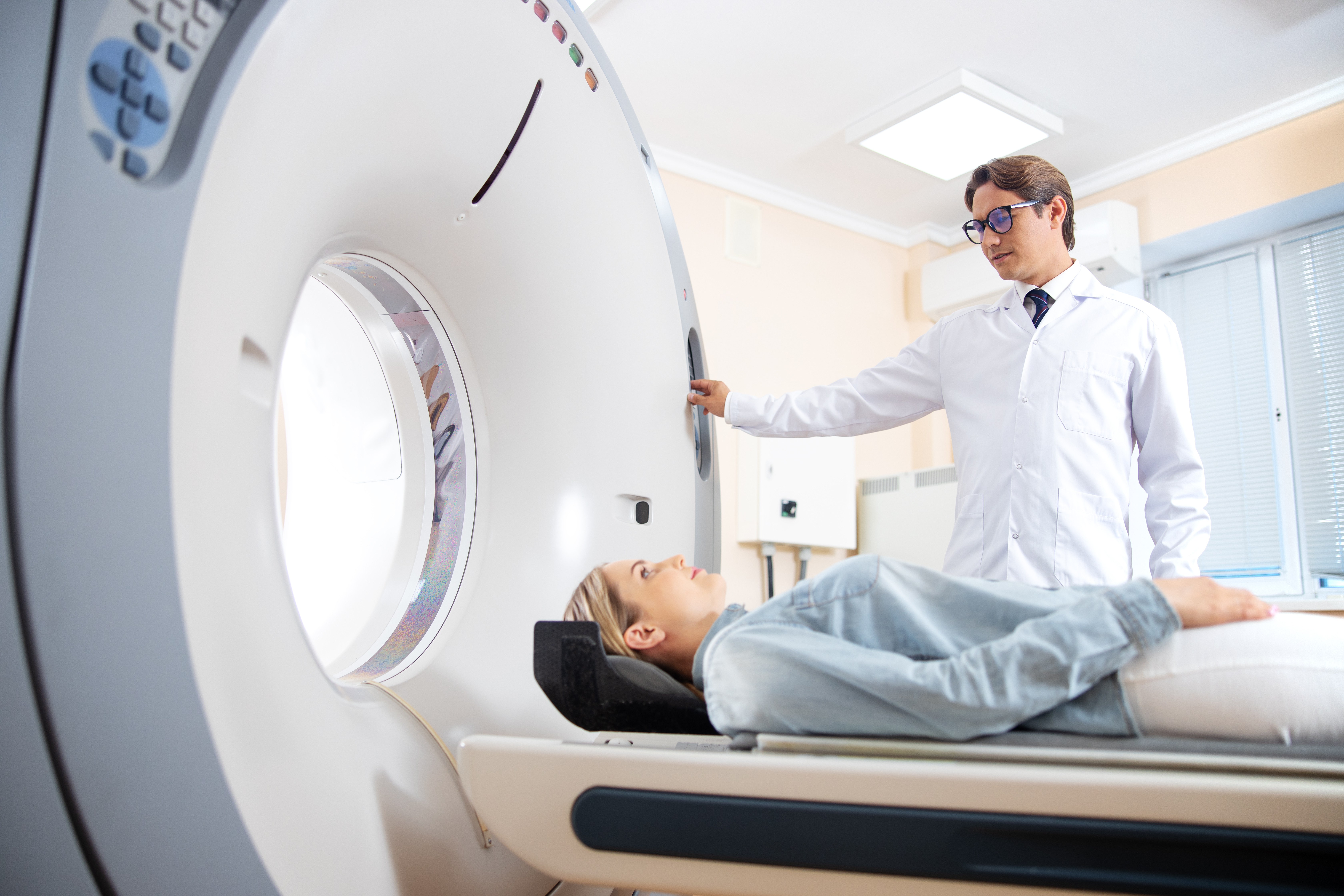 Young woman having CT scan in hospital