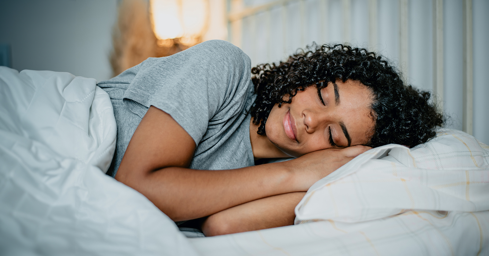 Teen sleeping in a bed