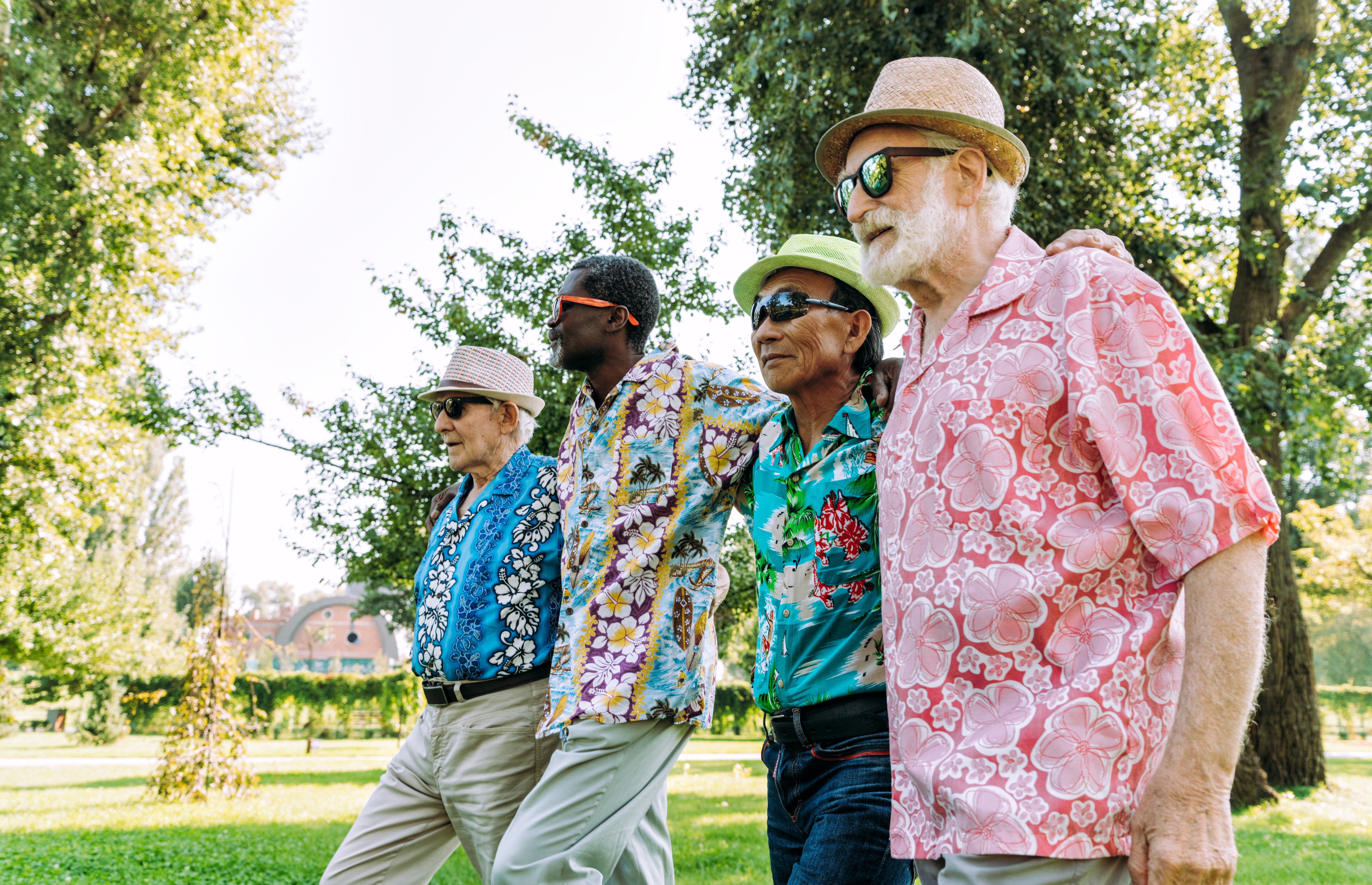 Four older men walking for exercise