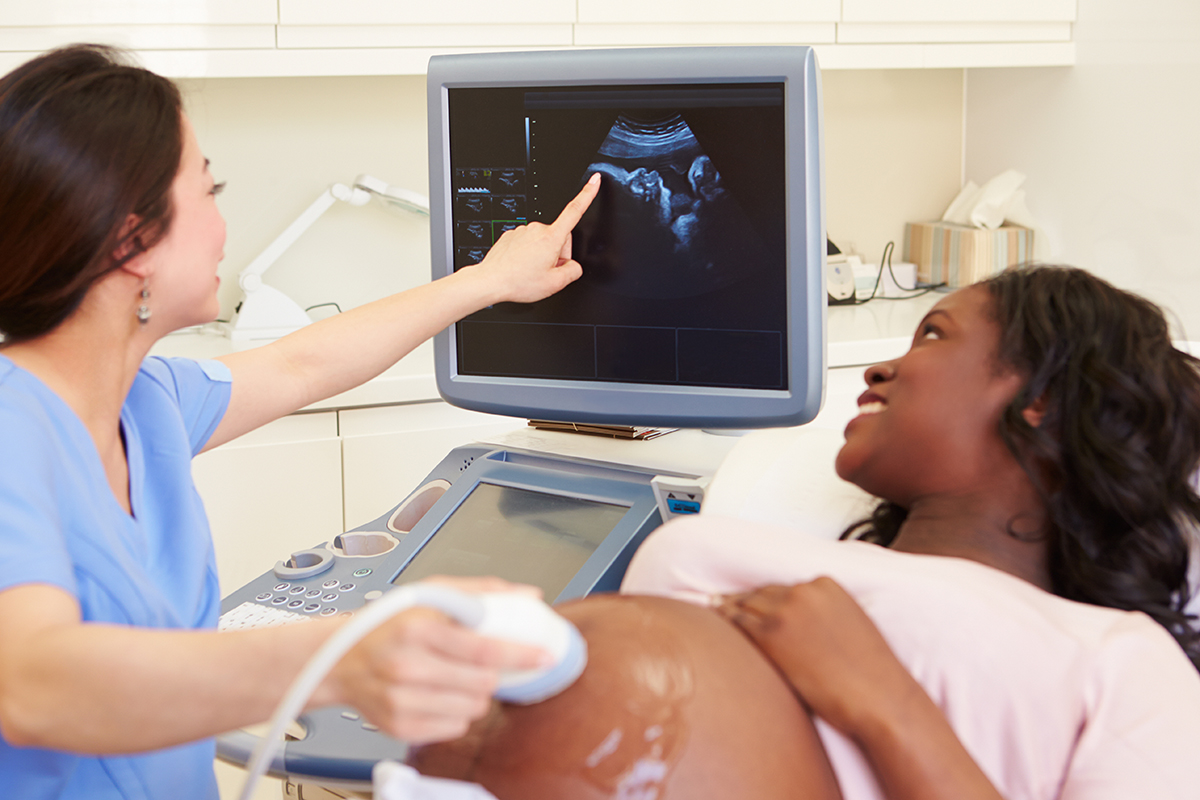 Image of a woman receiving a pregnancy ultrasound