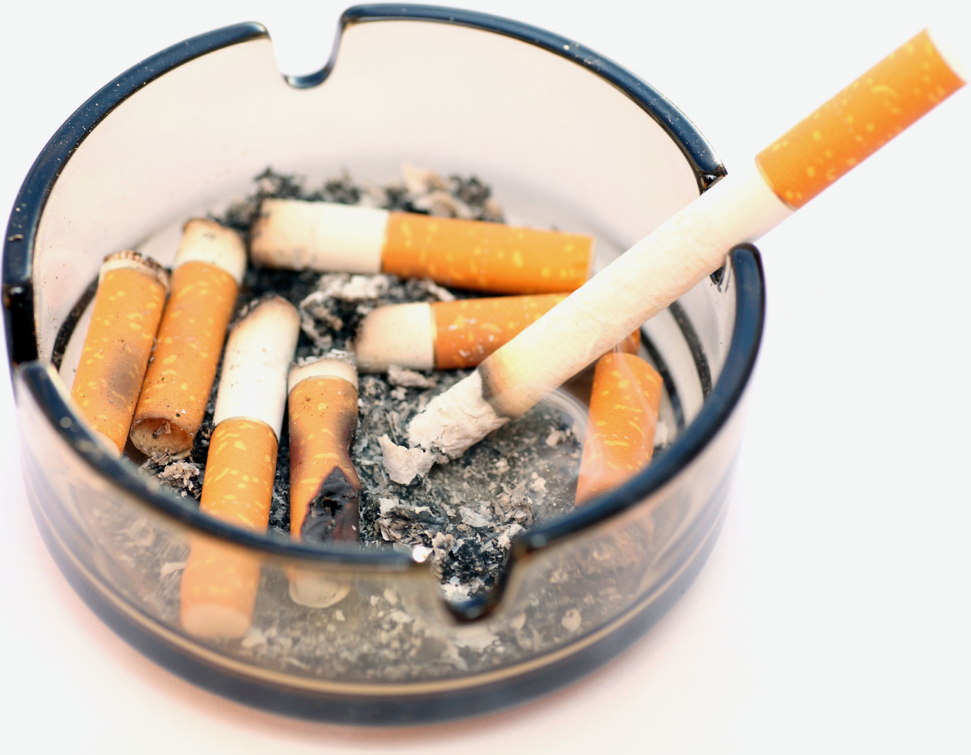 Photo of ashtray filled with cigarette stubs