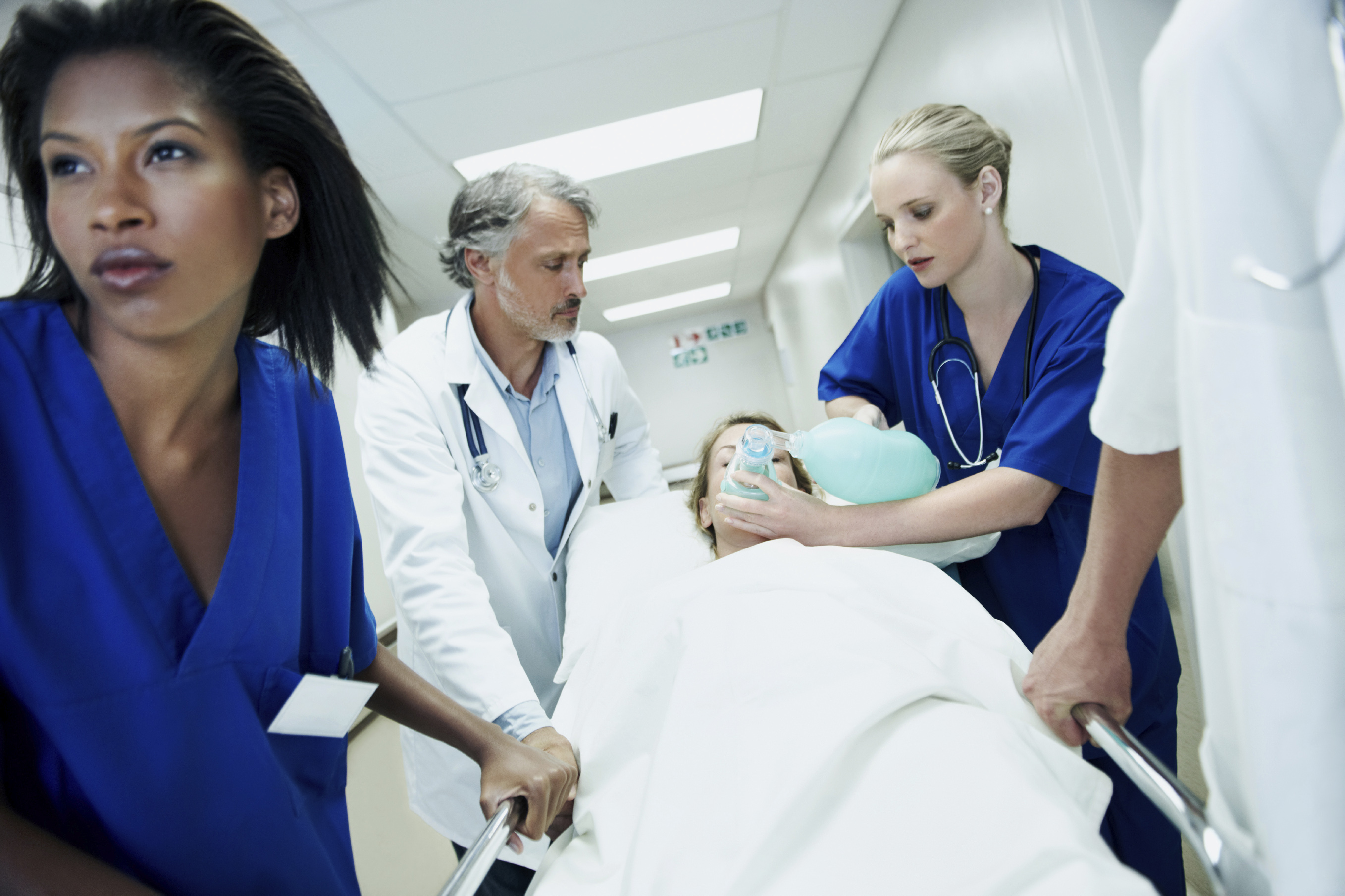 Photo of a medical team rushing a sick patient to the emergency ward.