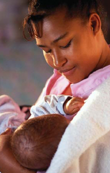 A mother breastfeeding her baby.