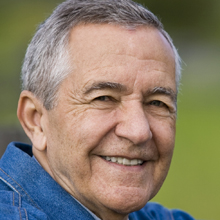 Close-up of a senior man smiling.