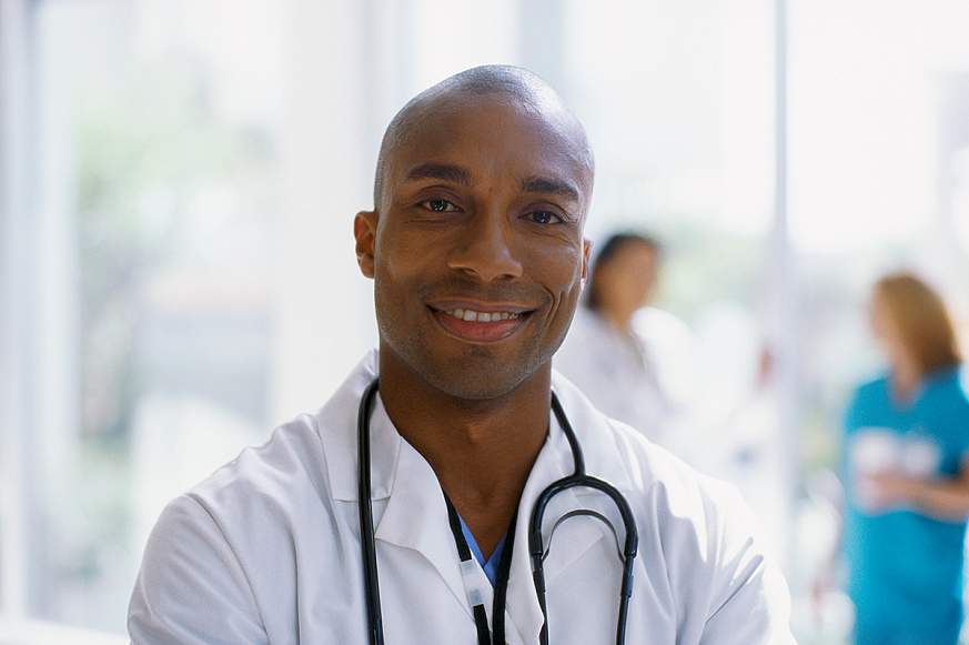 A doctor smiling for the camera.