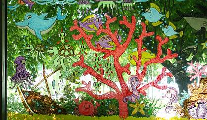 Coral tree memorializes Weller’s daughter Lauren Painting of coral and sea creatures on a window.