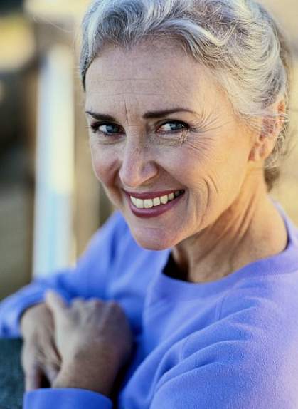 photo of a woman smiling photo of a woman smiling