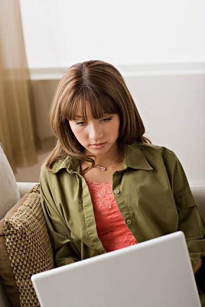 young woman at her computer young woman at her computer