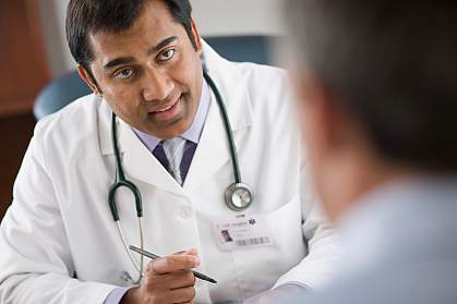 Picture of therapist congratulating a patient Picture of therapist congratulating a patient