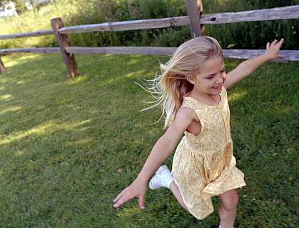 A young girl running in the park A young girl running in the park