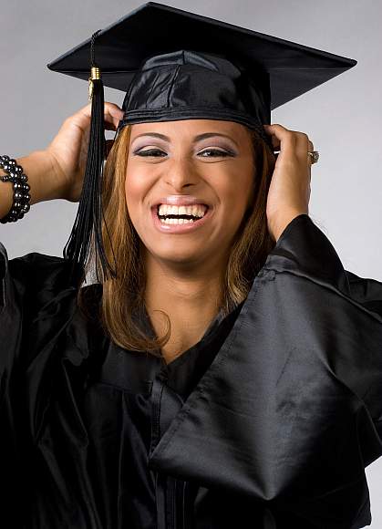 Photo of a female college graduate smiling Photo of a female college graduate smiling
