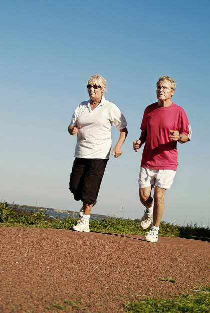 a photo of a man and a woman jogging a photo of a man and a woman jogging