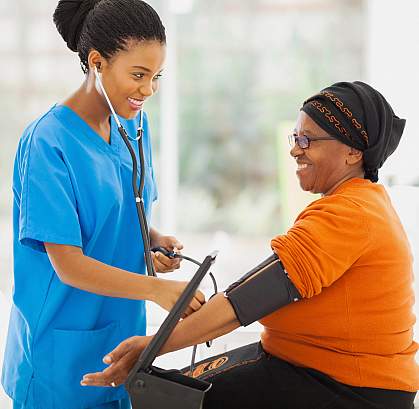 a photo of a woman having her blood pressure taken a photo of a woman having her blood pressure taken