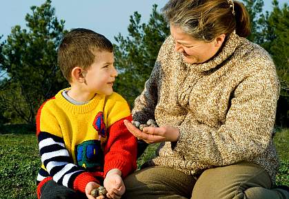 Photo of a mother and her young son talking Photo of a mother and her young son talking
