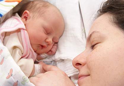 Photo of a baby and mother Photo of a baby and mother