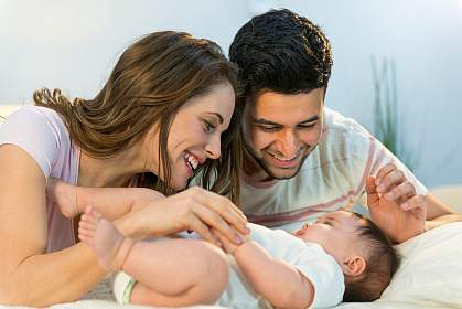 Photo of a woman, a man, and a baby Photo of a woman, a man, and a baby