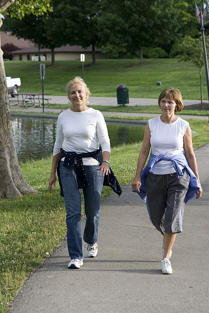 Photo of two women walking Photo of two women walking