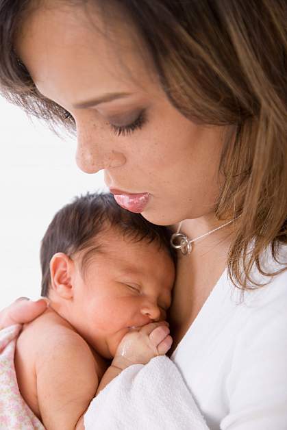 Photo of a woman holding an infant Photo of a woman holding an infant