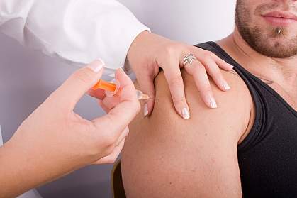 a photo of a man receiving an injection a photo of a man receiving an injection