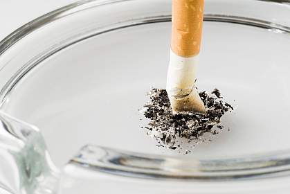 Photo of a cigarette stubbed out in an ashtray Photo of a cigarette stubbed out in an ashtray