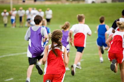 Photo of a group of tweens running Photo of a group of tweens running