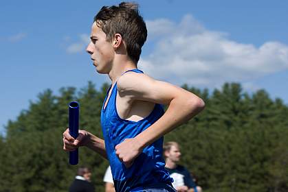 photo of a teenage boy running photo of a teenage boy running
