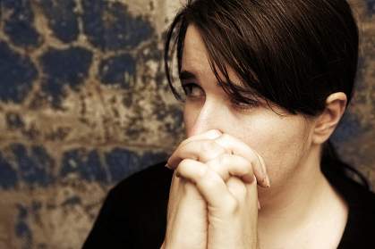 photo of woman looking worried photo of woman looking worried