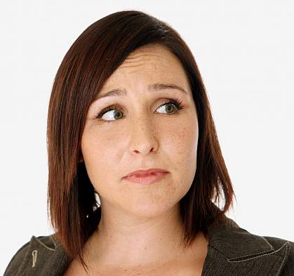 Photo of a woman looking nervous Photo of a woman looking nervous