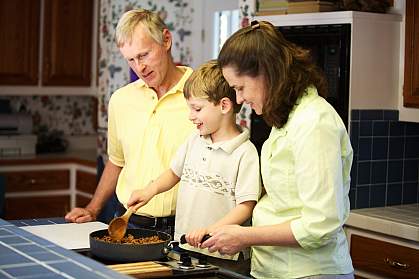 Photo of a family cooking