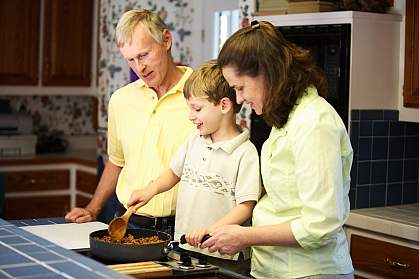 Photo of a family cooking Photo of a family cooking
