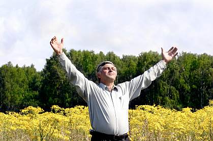 Photo of a man standing in a field Photo of a man standing in a field