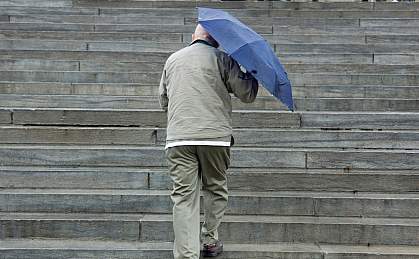Photo of a man climbing stairs Photo of a man climbing stairs