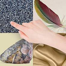 Image of a hand surrounded by items of different textures Image of a hand surrounded by items of different textures