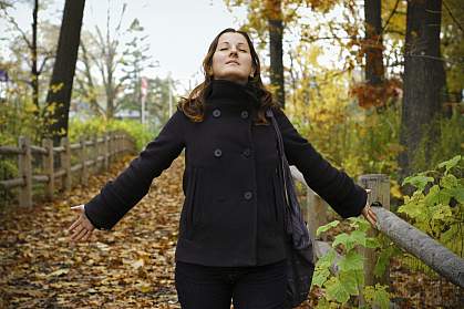 Photo of a woman standing outdoors