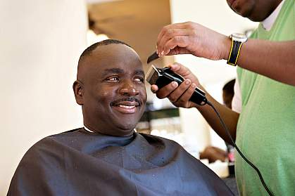 Photo of an African American man at the barber Photo of an African American man at the barber