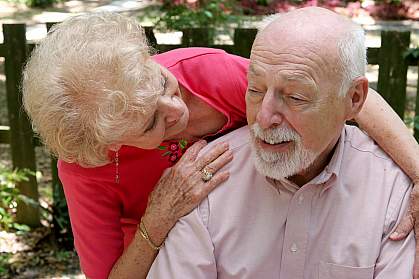 Photo of an older woman caring for her husband Photo of an older woman caring for her husband