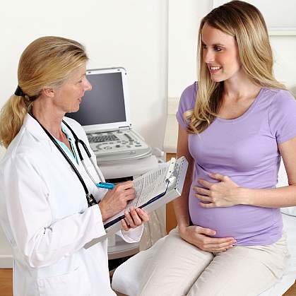 Photo of a doctor and pregnant woman Photo of a doctor and pregnant woman