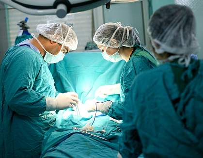 Doctors performing surgery Doctors performing surgery.