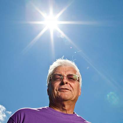 Older man with blazing sun Older man with blazing sun.