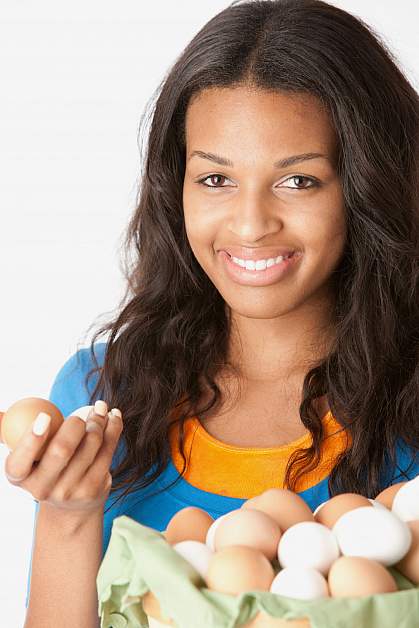 Teenager holding eggs Teenager holding eggs.