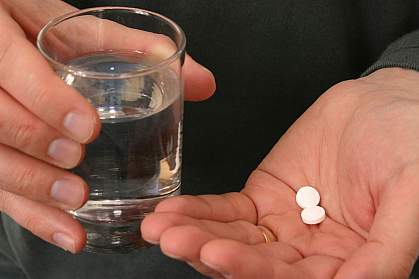 Aspirin in a hand Aspirin in a hand.