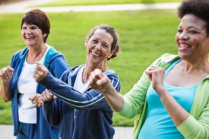 Women in their 50s and 60s exercising outdoors Women in their 50s and 60s exercising outdoors.