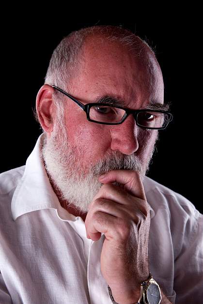 Bearded man in his 60s lost in thought Bearded man in his 60s lost in thought.