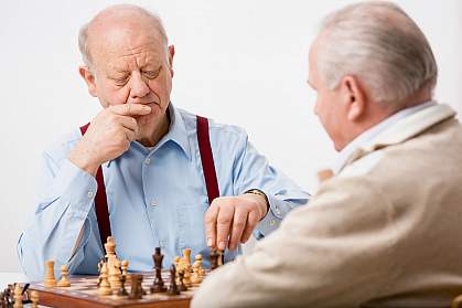 Senior men playing chess Senior men playing chess