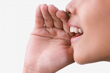 Close-up photo of a woman speaking. Close-up photo of a woman speaking.