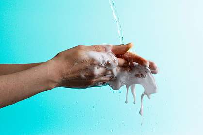 Woman washing her hands vigorously. Woman washing her hands vigorously.