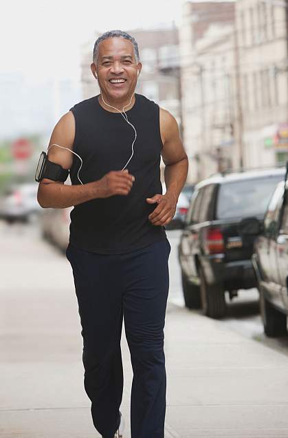 An older man jogging An older man jogging.