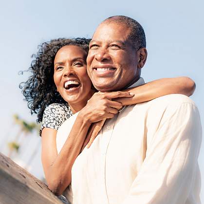 Happy mature couple looking at view. Happy mature couple looking at view.