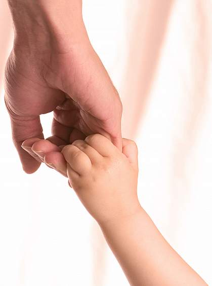 Holding hands of an adult and child Holding hands of an adult and child.